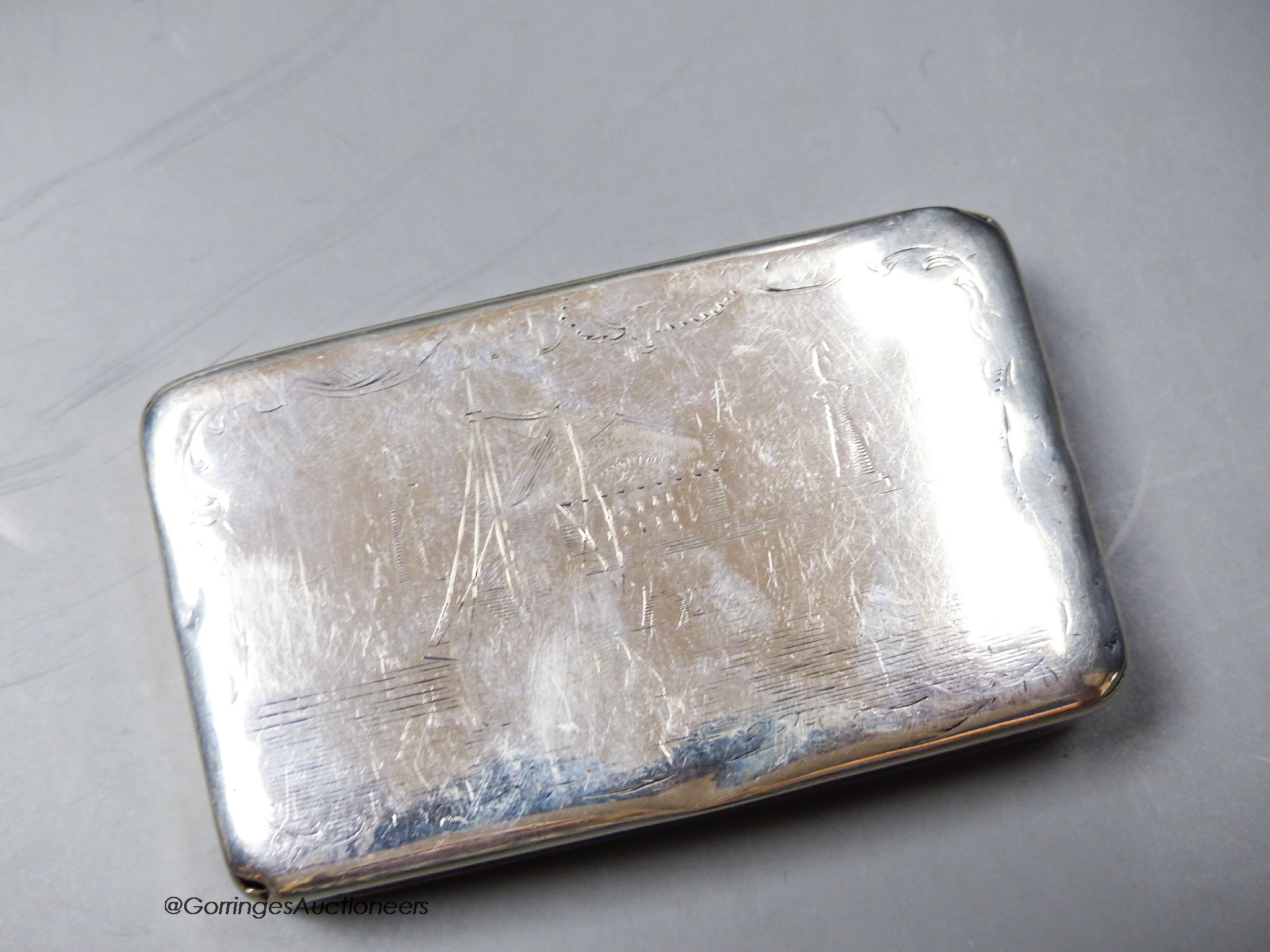 A mid 19th century Russian 84 zolotnik snuff box, with engraved decoration(very tired), dated 1843, 8.5cm, 111 grams.